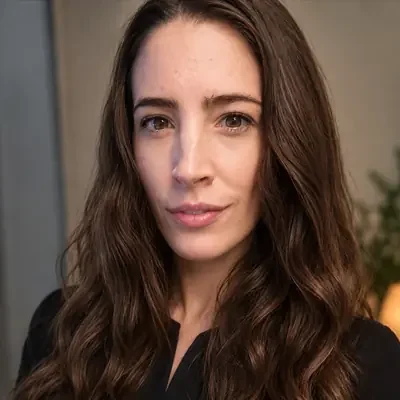 Autumn Pogorzelski smiling at the camera while wearing a black top